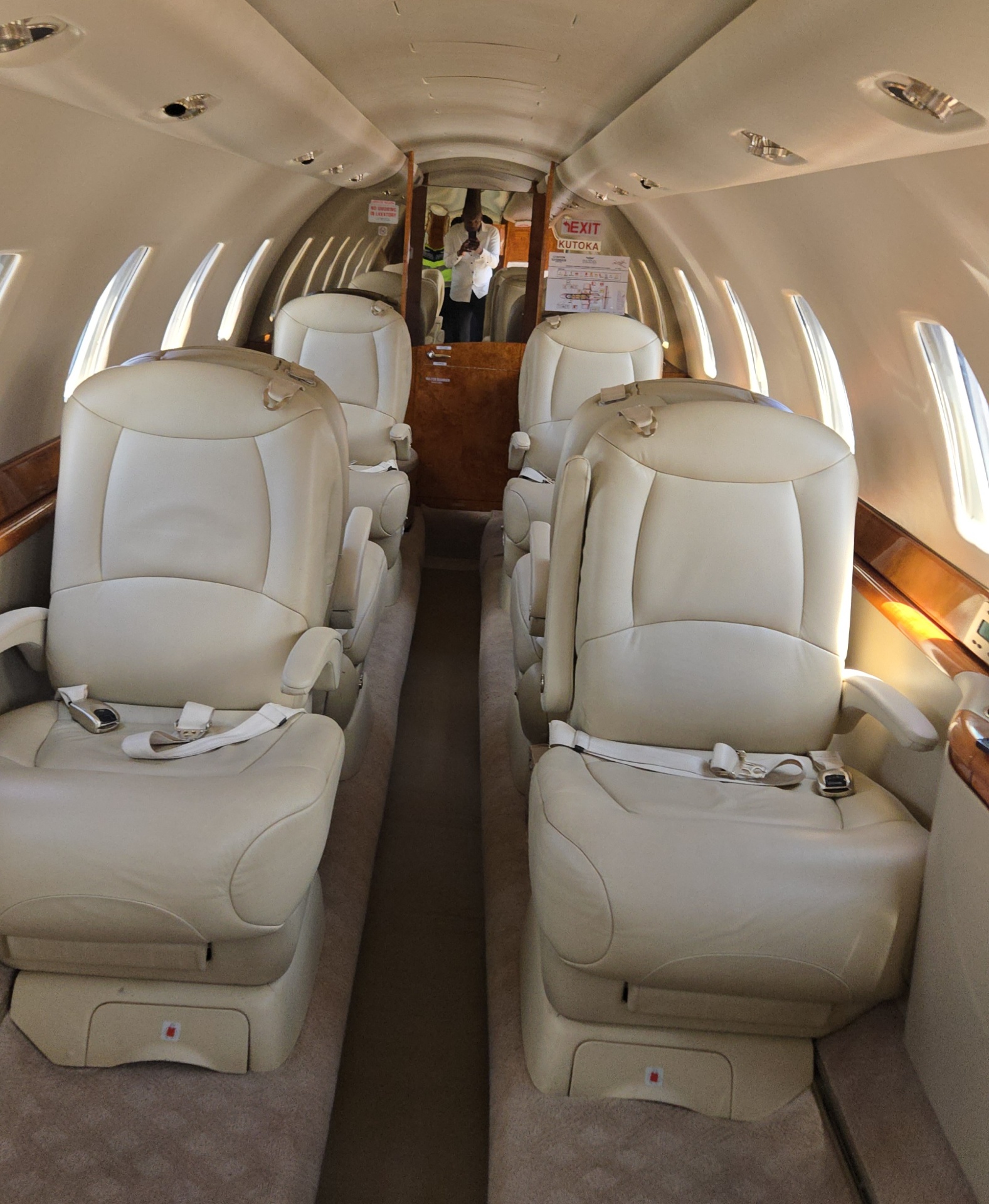 Cessna Citation Sovereign cabin with cream leather seats and burl wood trim