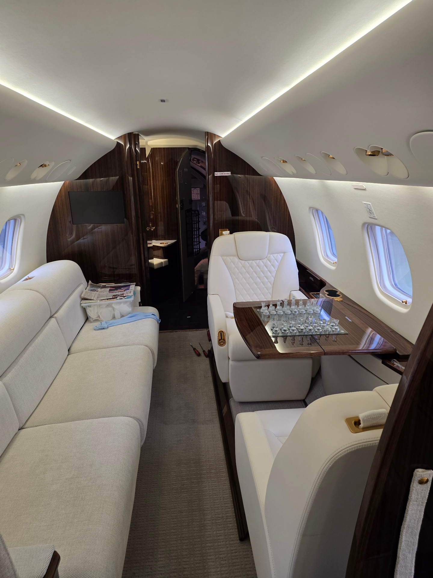 Embraer Legacy 650 aft lounge area with divan and dining table